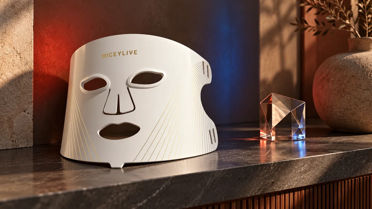White MICEYLIVE mask beside a glass prism with red and blue background reflections